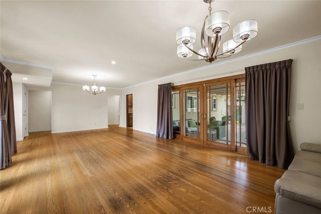924 Crestview Drive Pasadena, CA 91107 - Photo 8 of 33 a view of an empty room with wooden floor and a window