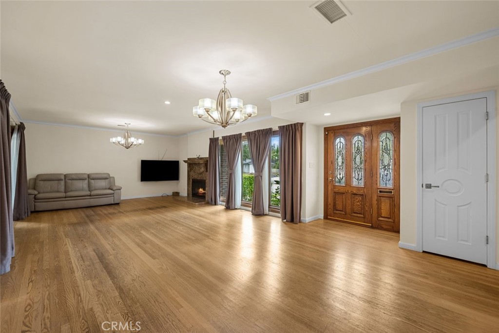 924 Crestview Drive Pasadena, CA 91107 - Photo 9 of 33 a view of a big room with wooden floor a kitchen space a sink and a refrigerator