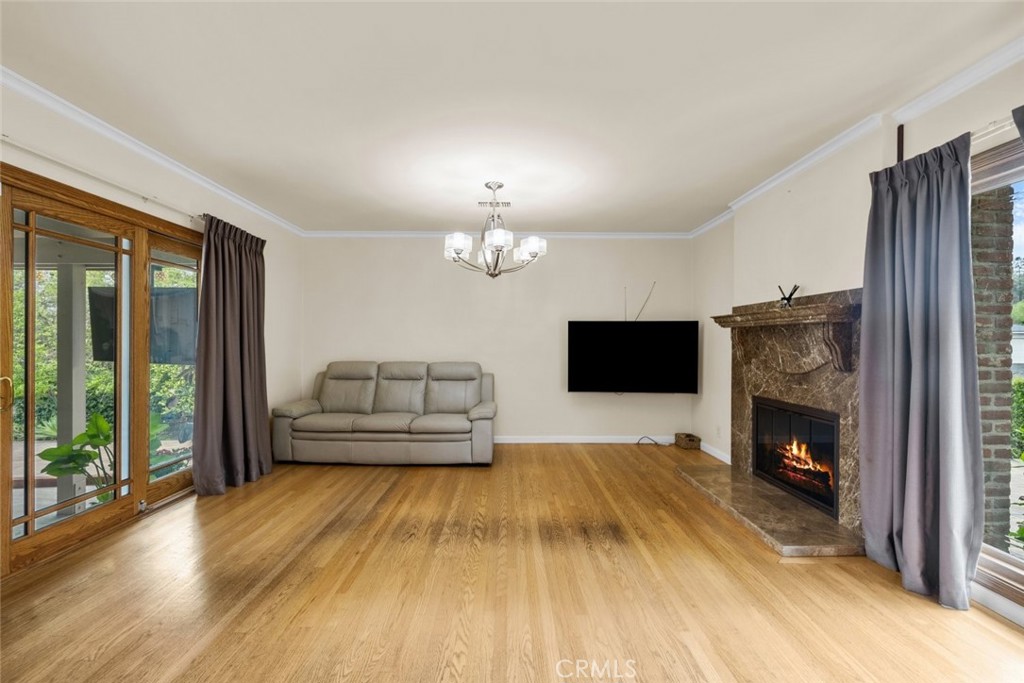 924 Crestview Drive Pasadena, CA 91107 - Photo 10 of 33 a living room with furniture and a fireplace