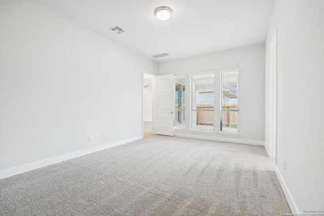 an empty room with windows