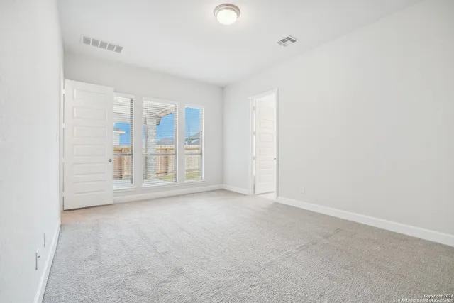 an empty room with windows