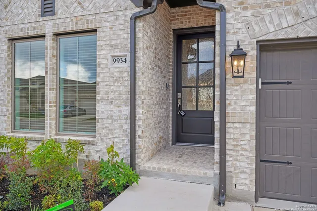 front door of brick house with a large door