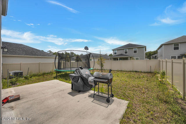 136 Peace River Road St. Johns, FL 32259 - Photo 12 of 52 a view of a patio with a table and chairs