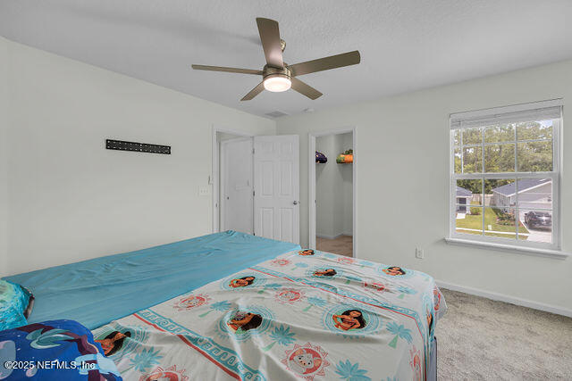 136 Peace River Road St. Johns, FL 32259 - Photo 20 of 52 a bedroom with a bed and a dresser in it