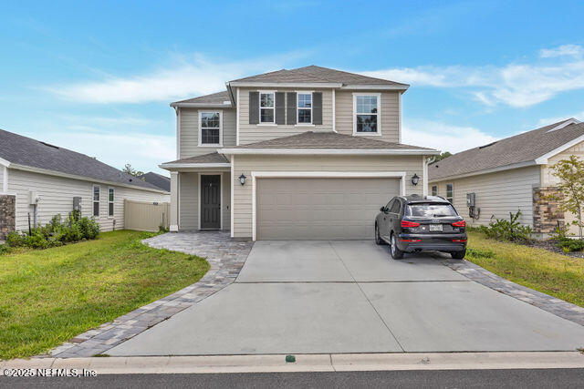 136 Peace River Road St. Johns, FL 32259 - Photo 2 of 52 a car parked in front of a house