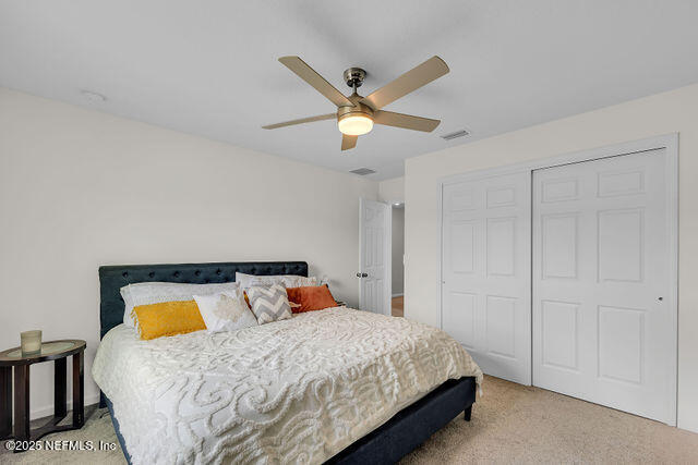 136 Peace River Road St. Johns, FL 32259 - Photo 27 of 52 a bedroom with a bed and window