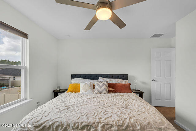 136 Peace River Road St. Johns, FL 32259 - Photo 28 of 52 a bedroom with a bed and window