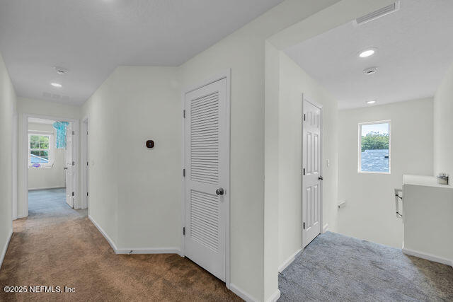 136 Peace River Road St. Johns, FL 32259 - Photo 30 of 52 wooden floor with closet and windows