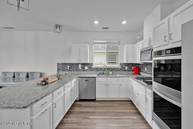 a bathroom with a sink mirror and toilet