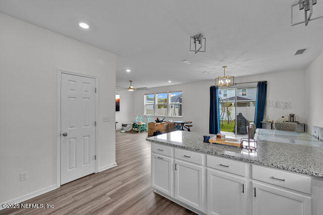 136 Peace River Road St. Johns, FL 32259 - Photo 34 of 52 a large bathroom with a double vanity sink and a mirror