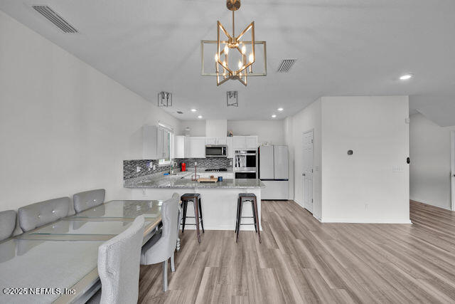 136 Peace River Road St. Johns, FL 32259 - Photo 37 of 52 a view of a dining room kitchen and a window