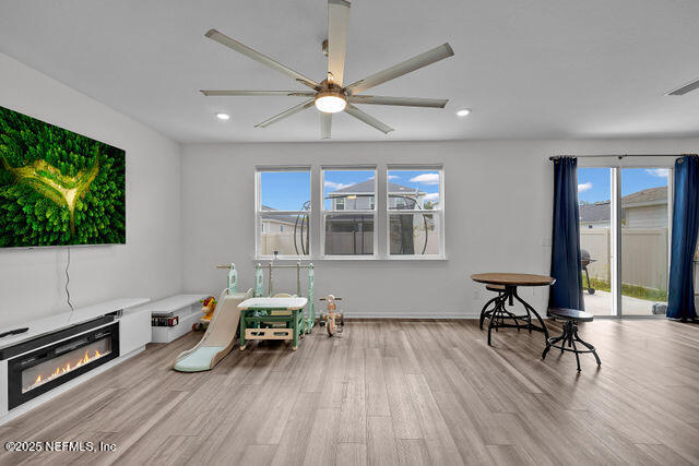 136 Peace River Road St. Johns, FL 32259 - Photo 40 of 52 a living room with furniture and a flat screen tv