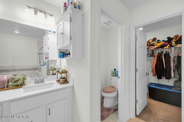 136 Peace River Road St. Johns, FL 32259 - Photo 47 of 52 a bathroom with a sink mirror and toilet