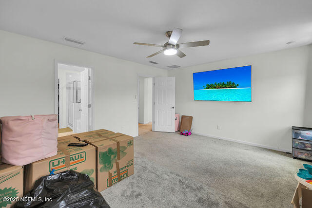 136 Peace River Road St. Johns, FL 32259 - Photo 50 of 52 a bedroom with a bed and a chandelier