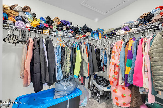136 Peace River Road St. Johns, FL 32259 - Photo 52 of 52 a view of walk in closet with clothes