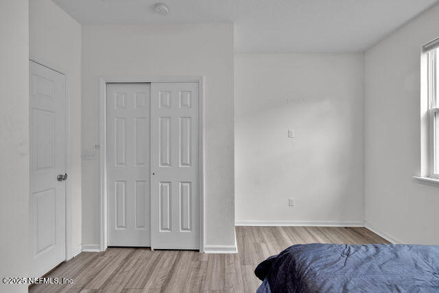 136 Peace River Road St. Johns, FL 32259 - Photo 8 of 52 a view of bedroom with a bed and wooden floor