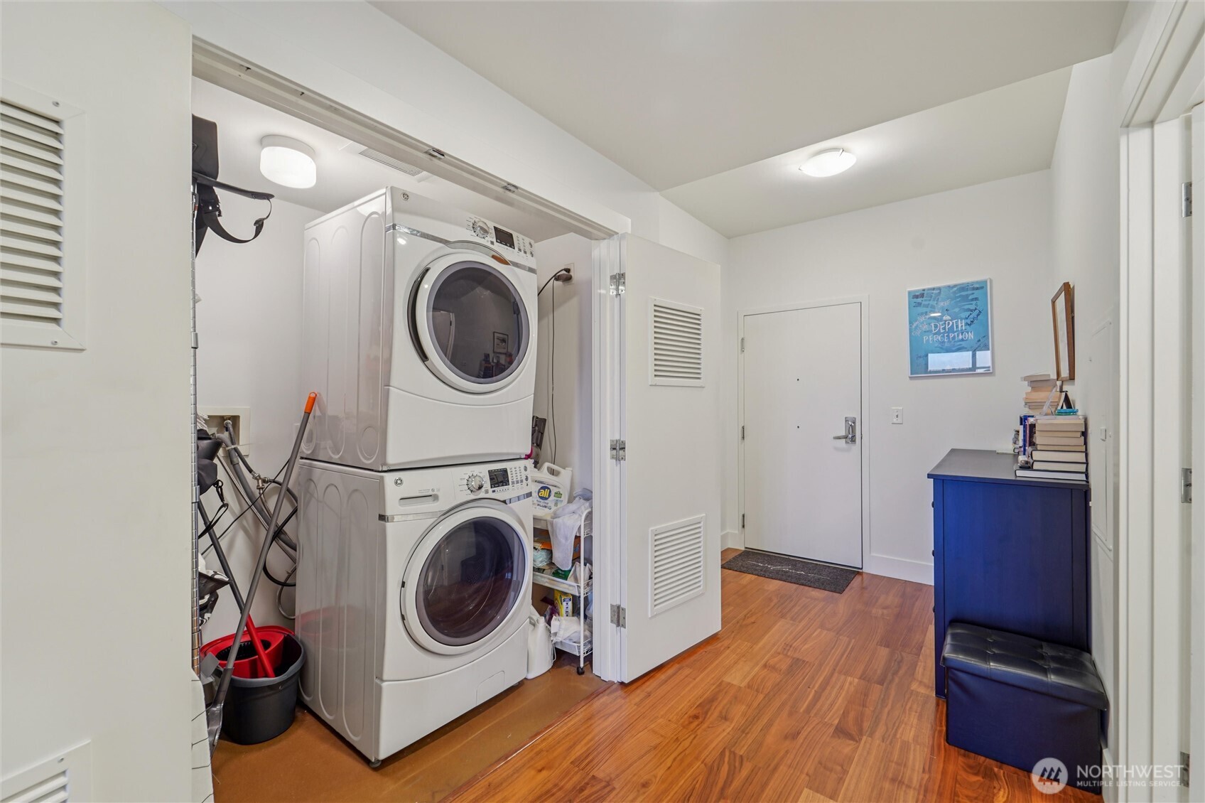 2911 2nd Avenue, Unit 818 Seattle, WA 98121 - Photo 12 of 15 a view of a storage & utility room with washer and dryer