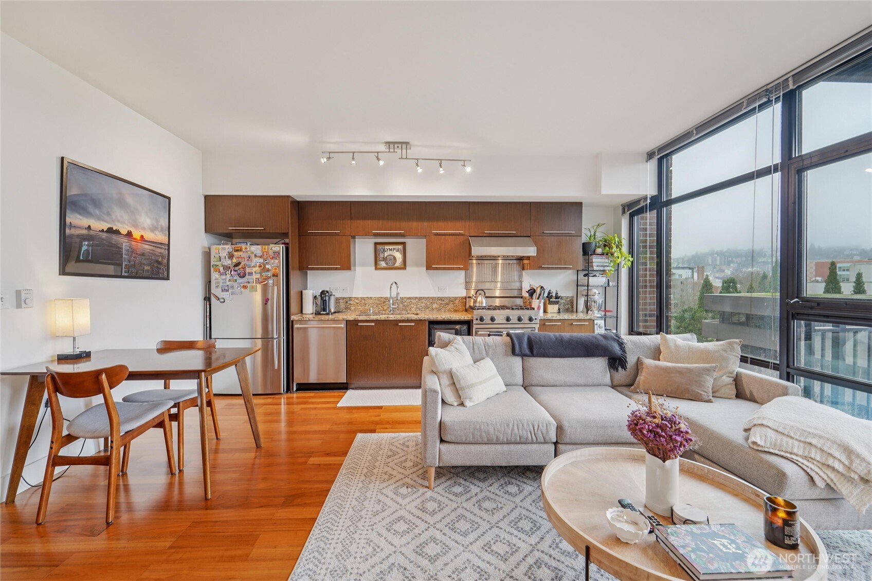 2911 2nd Avenue, Unit 818 Seattle, WA 98121 - Photo 14 of 15 a living room with furniture and a large window