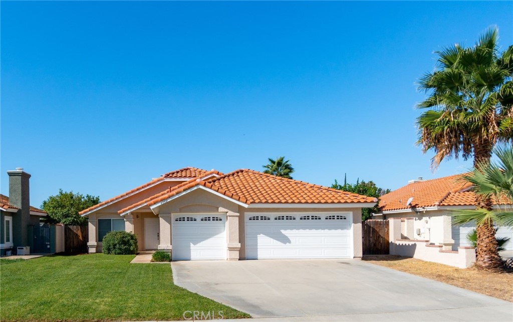 4552 Jeremiah Court Riverside, CA 92503 - Photo 1 of 1 a front view of a house with a yard