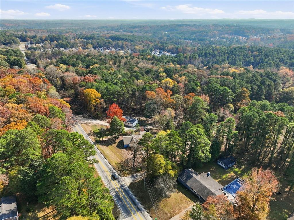 7411 Pleasant Hill Road Lithonia, GA 30058 - Photo 12 of 15 an aerial view of residential house with outdoor space