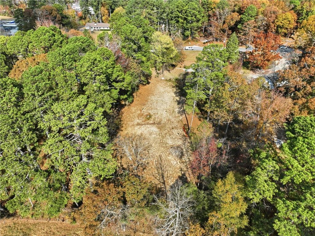 7411 Pleasant Hill Road Lithonia, GA 30058 - Photo 14 of 15 a view of a yard with plants