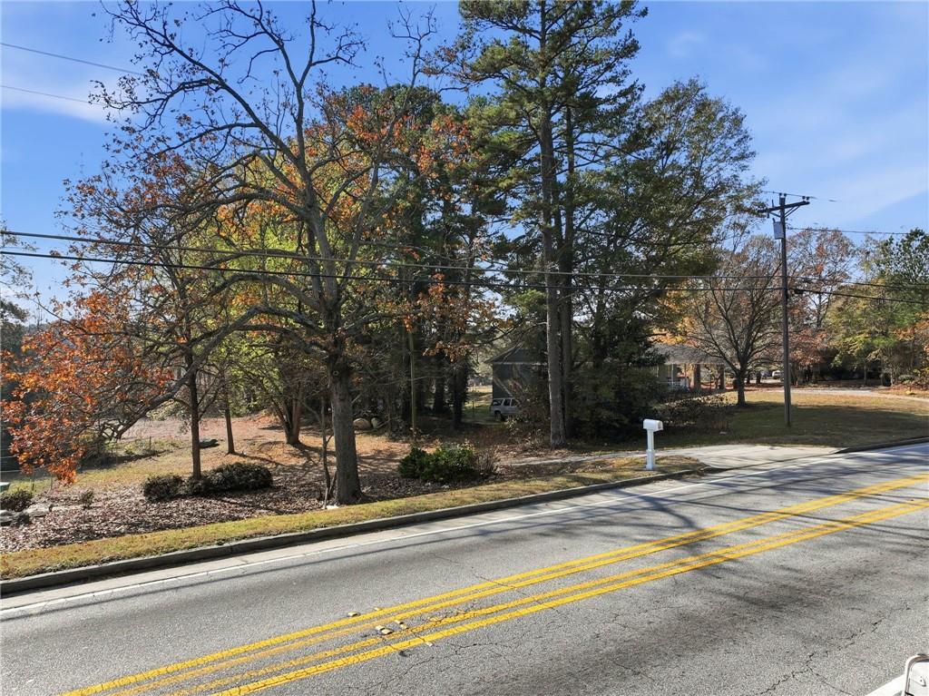 7411 Pleasant Hill Road Lithonia, GA 30058 - Photo 4 of 15 a view of a fountain with a trees in the background