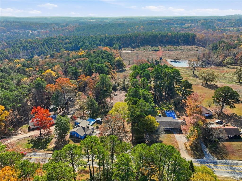 7411 Pleasant Hill Road Lithonia, GA 30058 - Photo 5 of 15 an aerial view of residential house with outdoor space