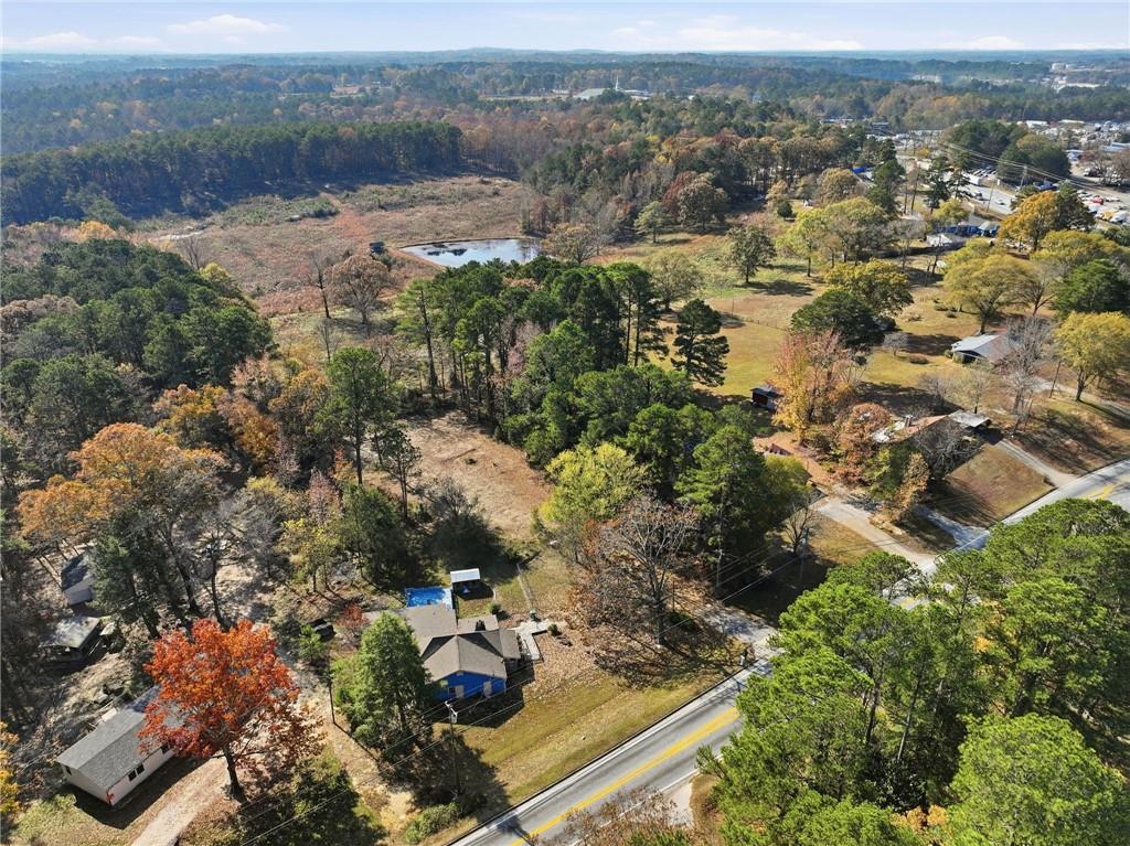 7411 Pleasant Hill Road Lithonia, GA 30058 - Photo 6 of 15 an aerial view of house with yard