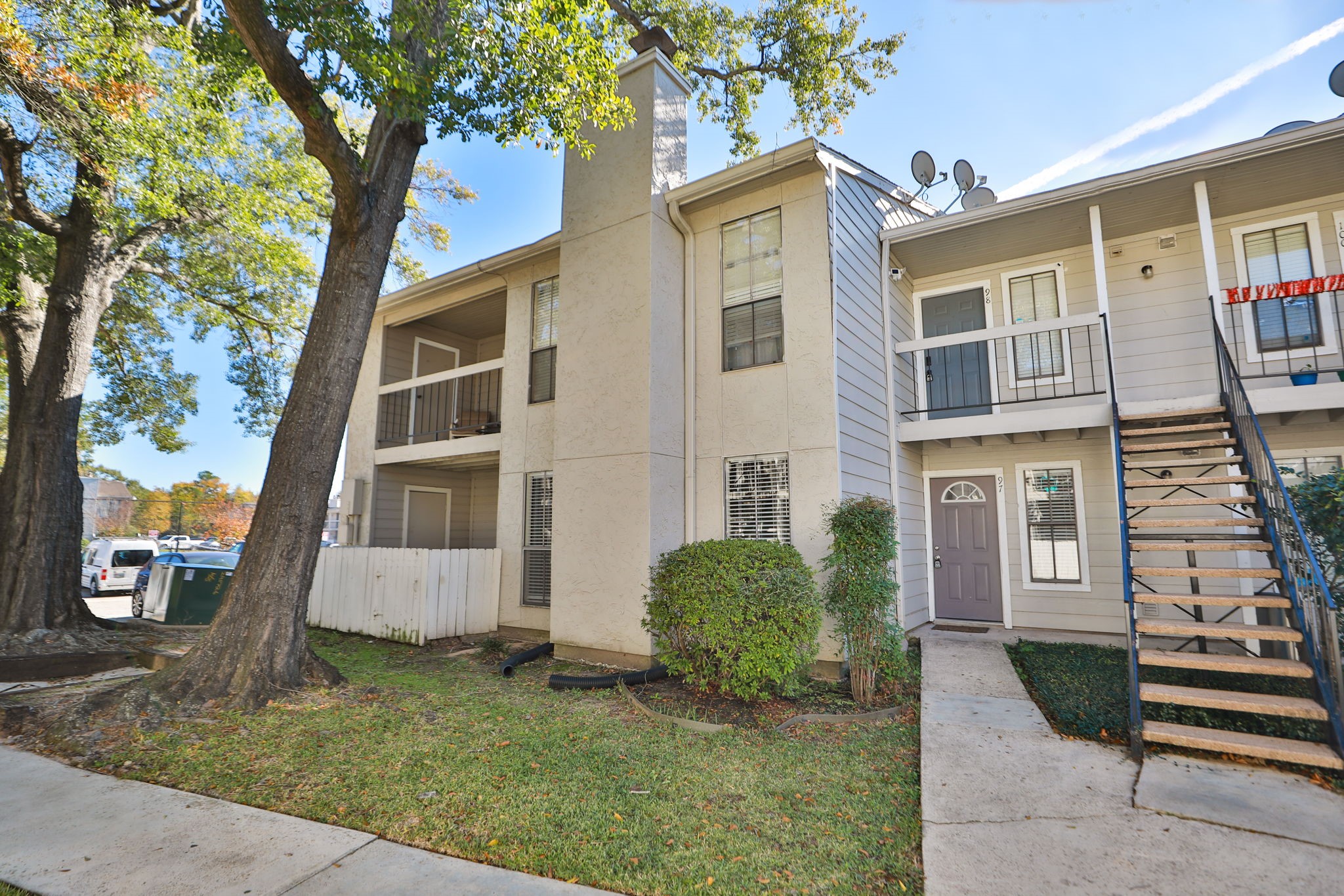 17401 Red Oak Drive, Unit 97 Houston, TX 77090 - Photo 30 of 37 front view of a house with a yard