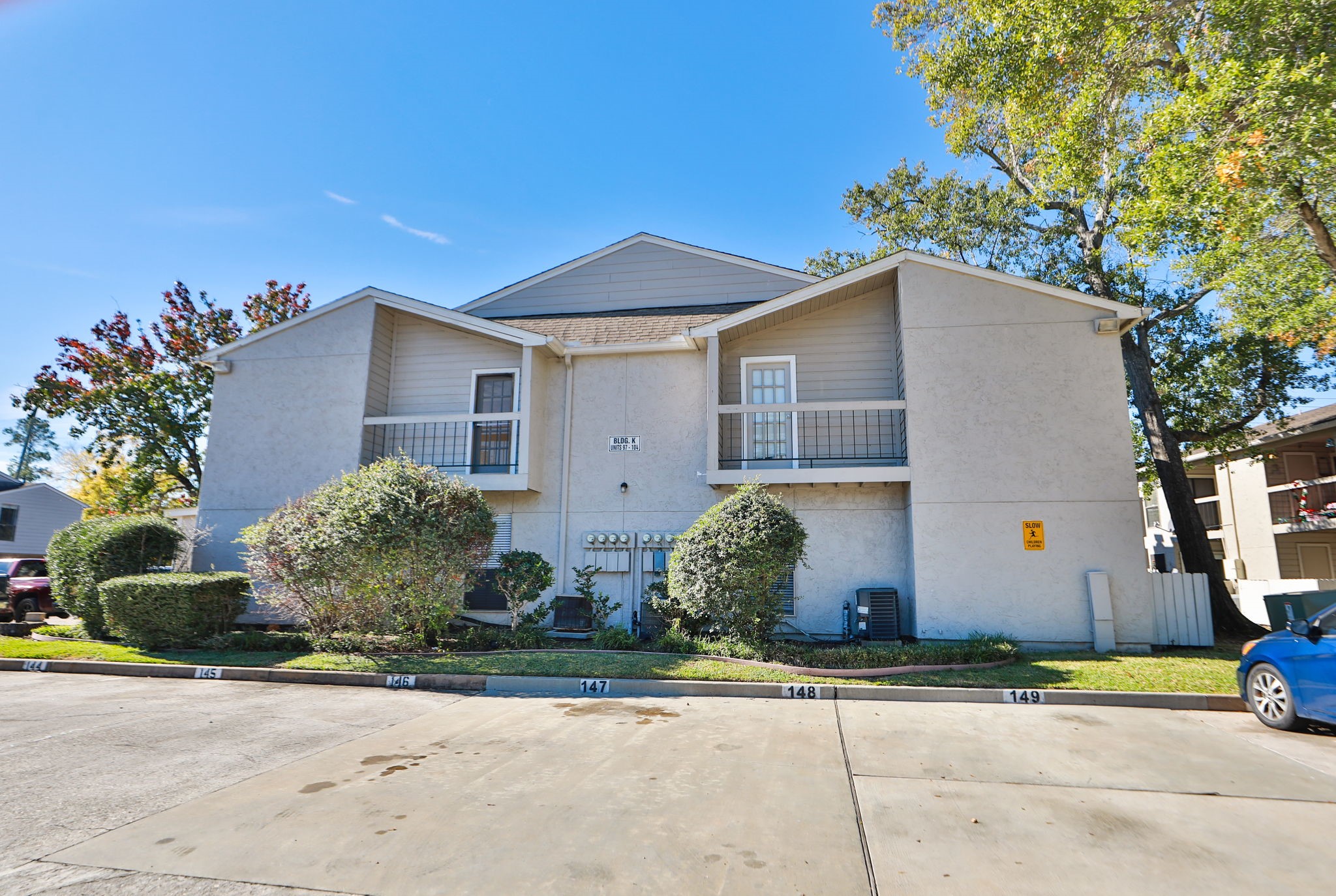 17401 Red Oak Drive, Unit 97 Houston, TX 77090 - Photo 31 of 37 a view of a house with a yard and plants