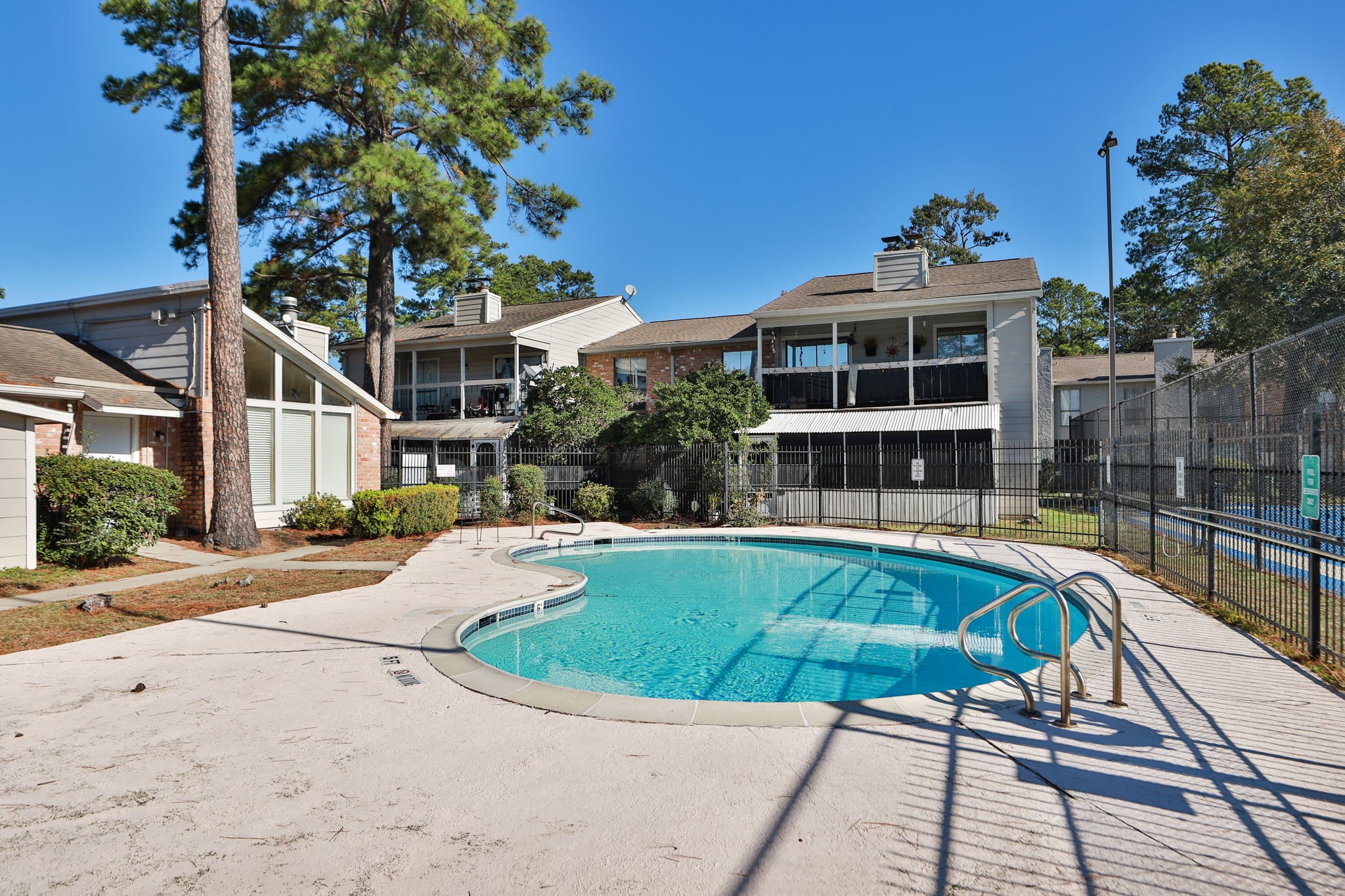 17401 Red Oak Drive, Unit 97 Houston, TX 77090 - Photo 32 of 37 a view of a house with swimming pool and sitting area