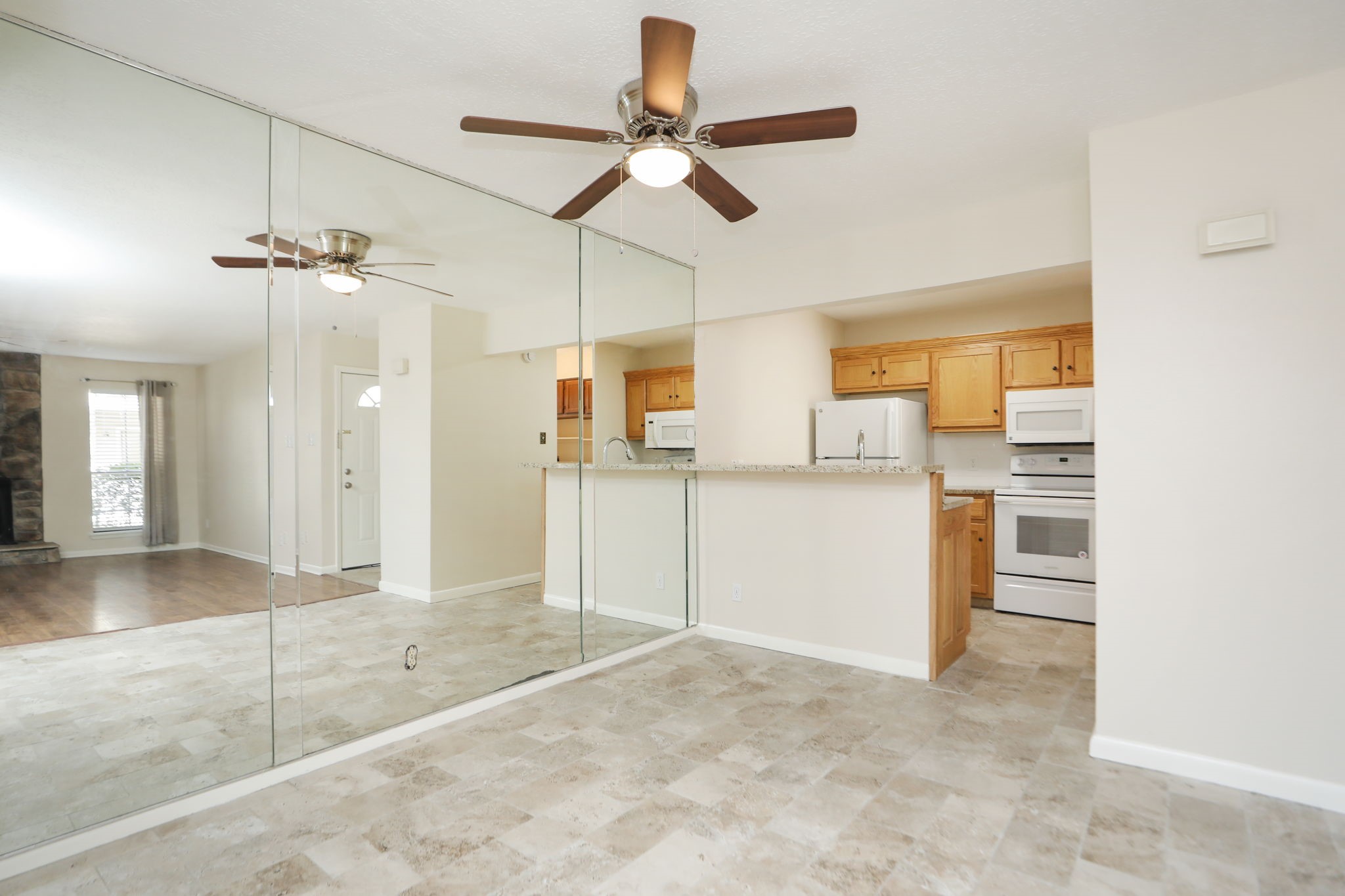 17401 Red Oak Drive, Unit 97 Houston, TX 77090 - Photo 10 of 37 a view of a kitchen with a sink and a refrigerator