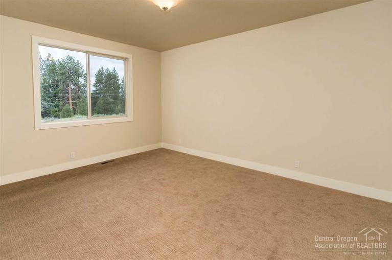61515 Southwest Blakely Road Bend, OR 97702 - Photo 13 of 20 an empty room with a window