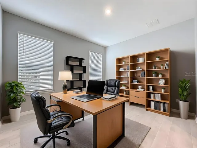 a view of a livingroom with furniture and a flat screen tv