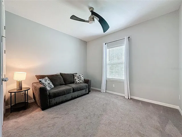 an empty room with closet and windows