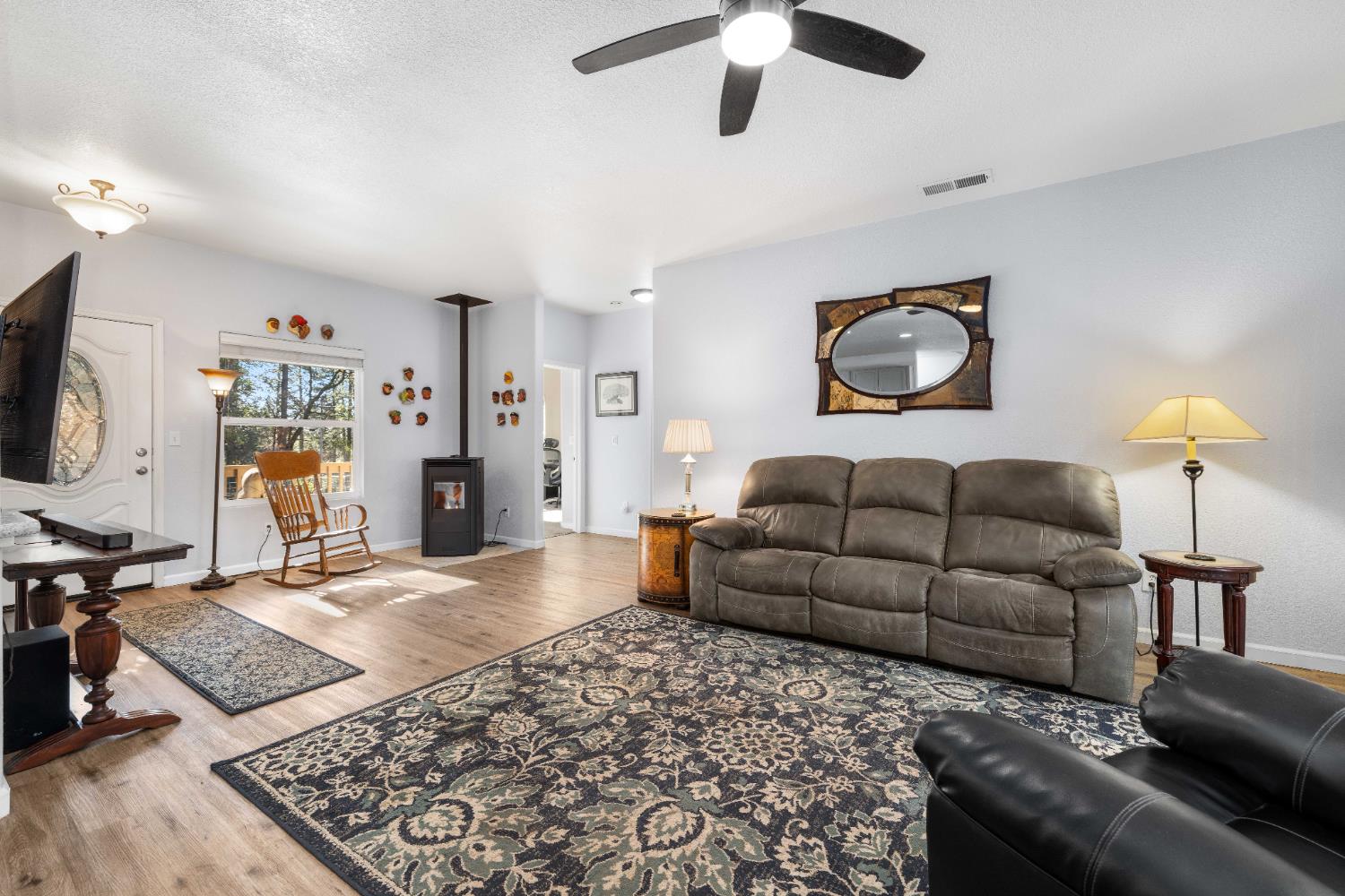 6843 Log Cabin Lane Placerville, CA 95667 - Photo 11 of 49 a living room with furniture and a flat screen tv
