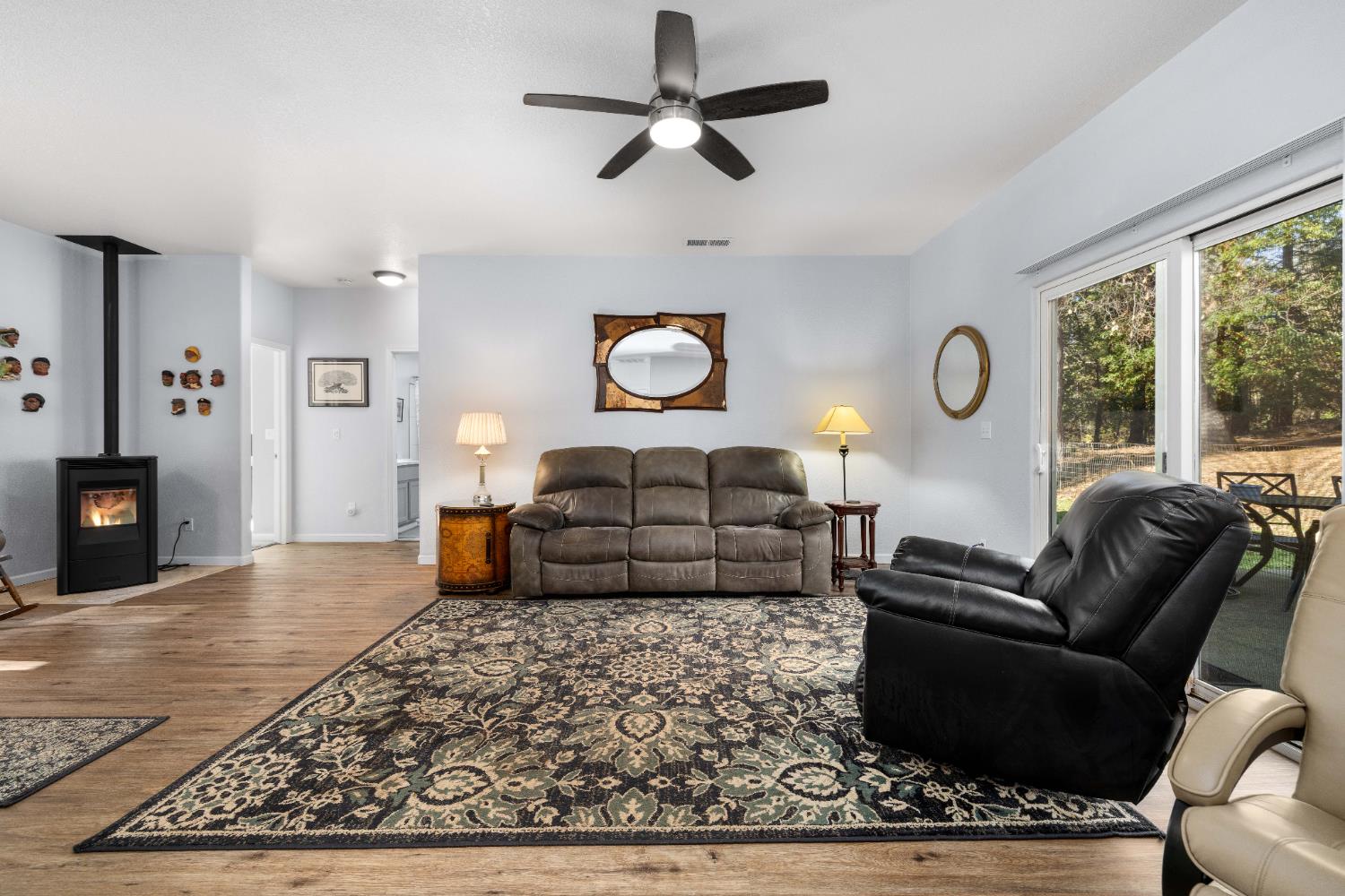 6843 Log Cabin Lane Placerville, CA 95667 - Photo 14 of 49 a living room with furniture a rug and a large window
