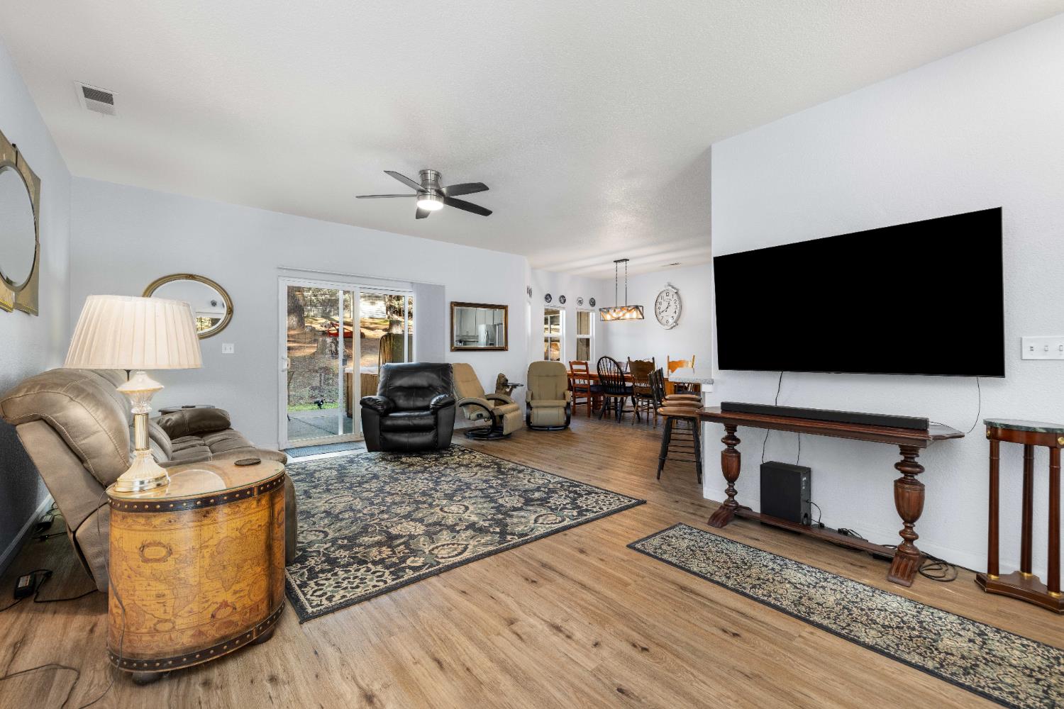 6843 Log Cabin Lane Placerville, CA 95667 - Photo 17 of 49 a living room with furniture and a flat screen tv