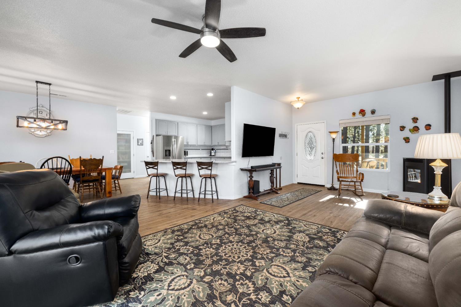 6843 Log Cabin Lane Placerville, CA 95667 - Photo 18 of 49 a living room with furniture and a flat screen tv