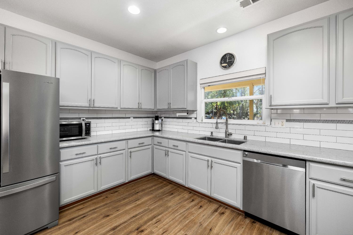 6843 Log Cabin Lane Placerville, CA 95667 - Photo 23 of 49 a kitchen with a sink white cabinets and white appliances