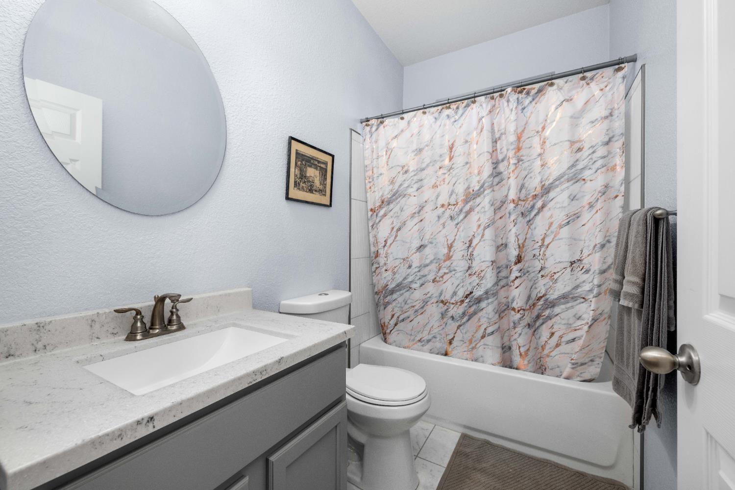 6843 Log Cabin Lane Placerville, CA 95667 - Photo 32 of 49 a bathroom with a granite countertop sink mirror vanity and toilet