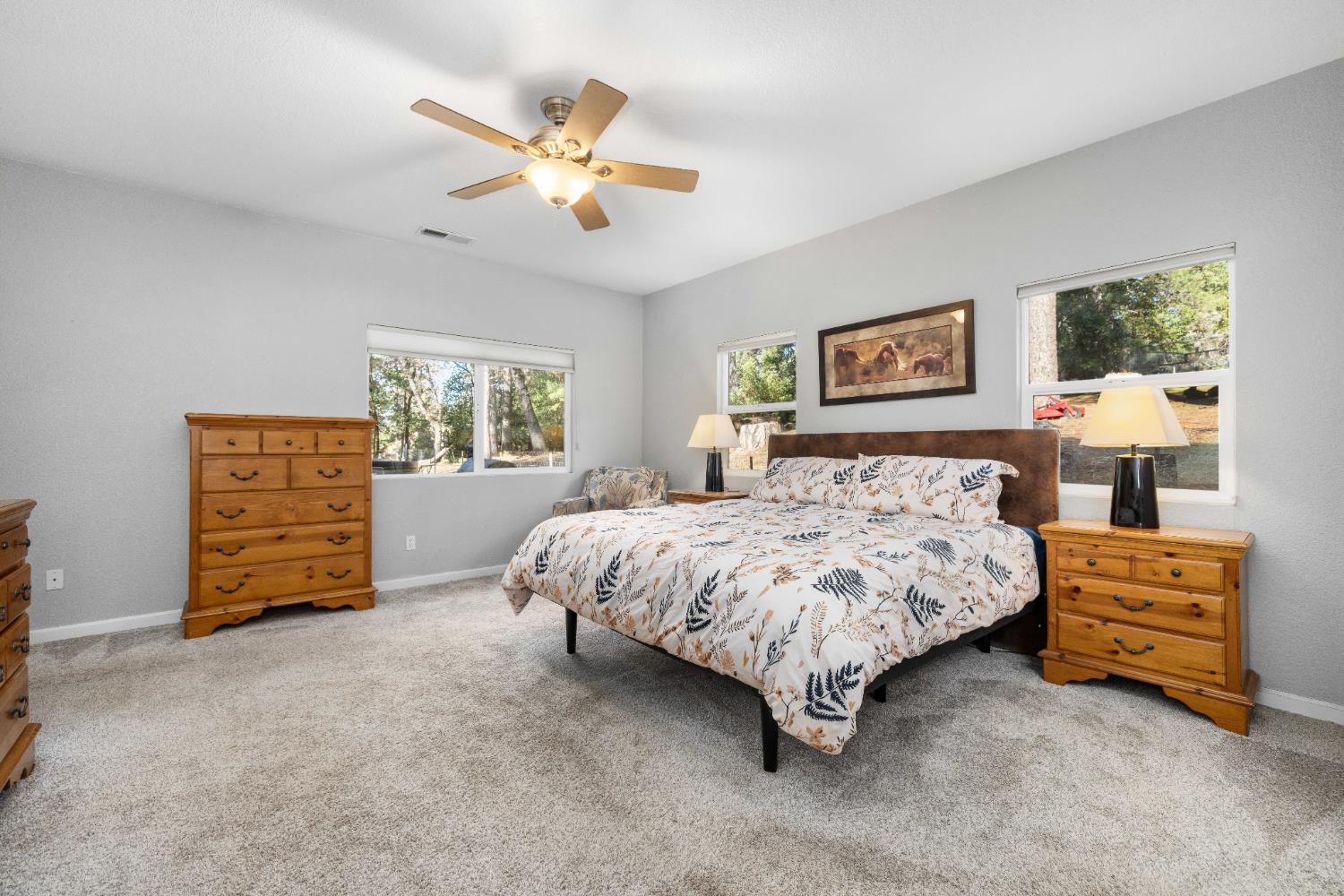 6843 Log Cabin Lane Placerville, CA 95667 - Photo 37 of 49 a spacious bedroom with a bed a dresser and a window