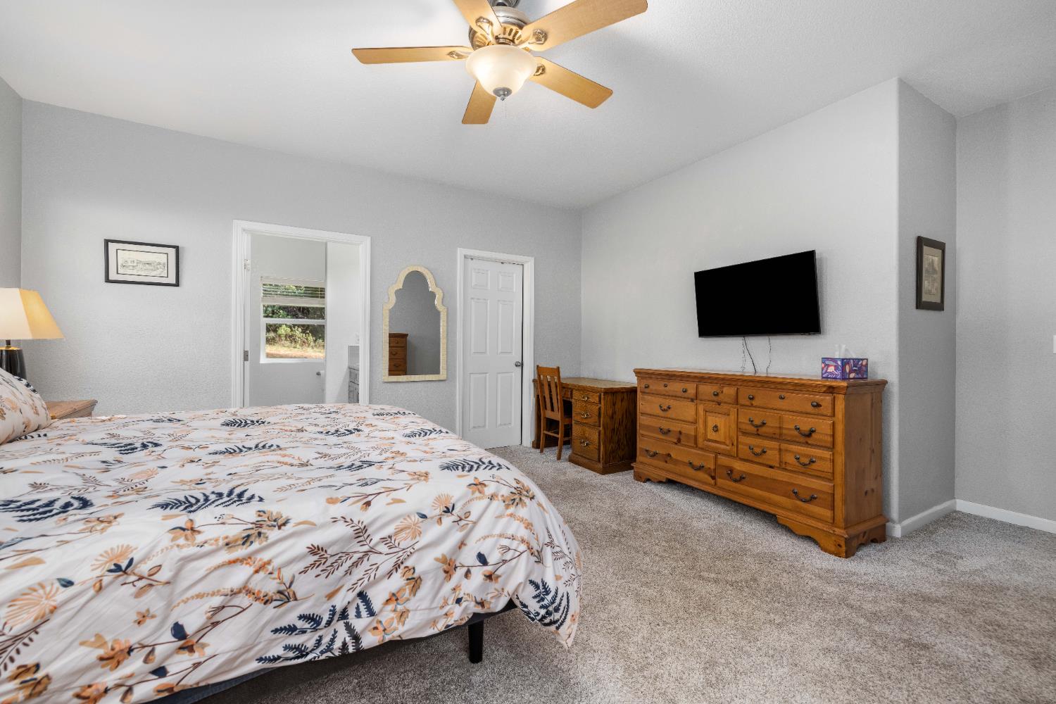 6843 Log Cabin Lane Placerville, CA 95667 - Photo 39 of 49 a bedroom with a bed and a flat screen tv