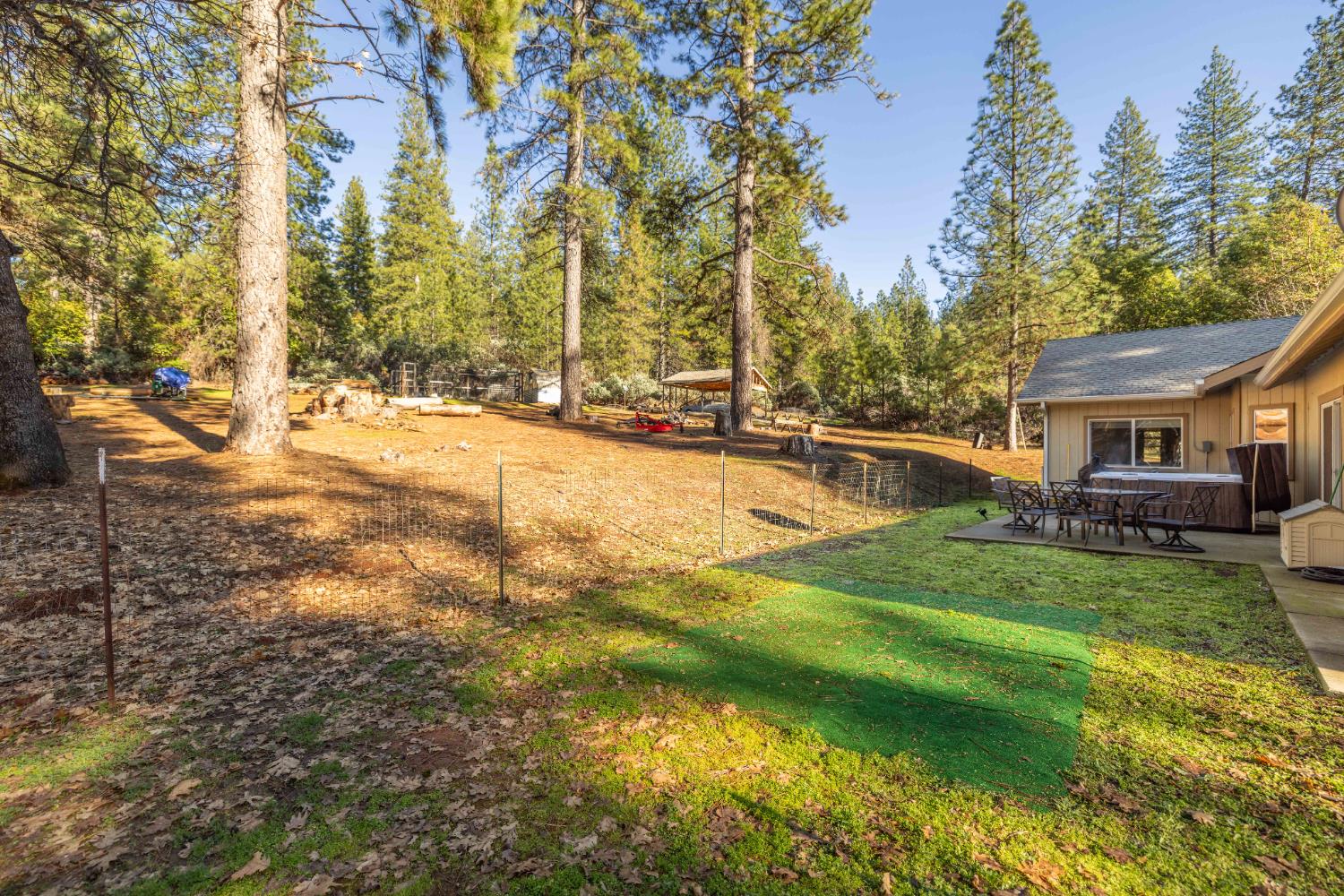 6843 Log Cabin Lane Placerville, CA 95667 - Photo 44 of 49 a backyard of a house with table and chairs