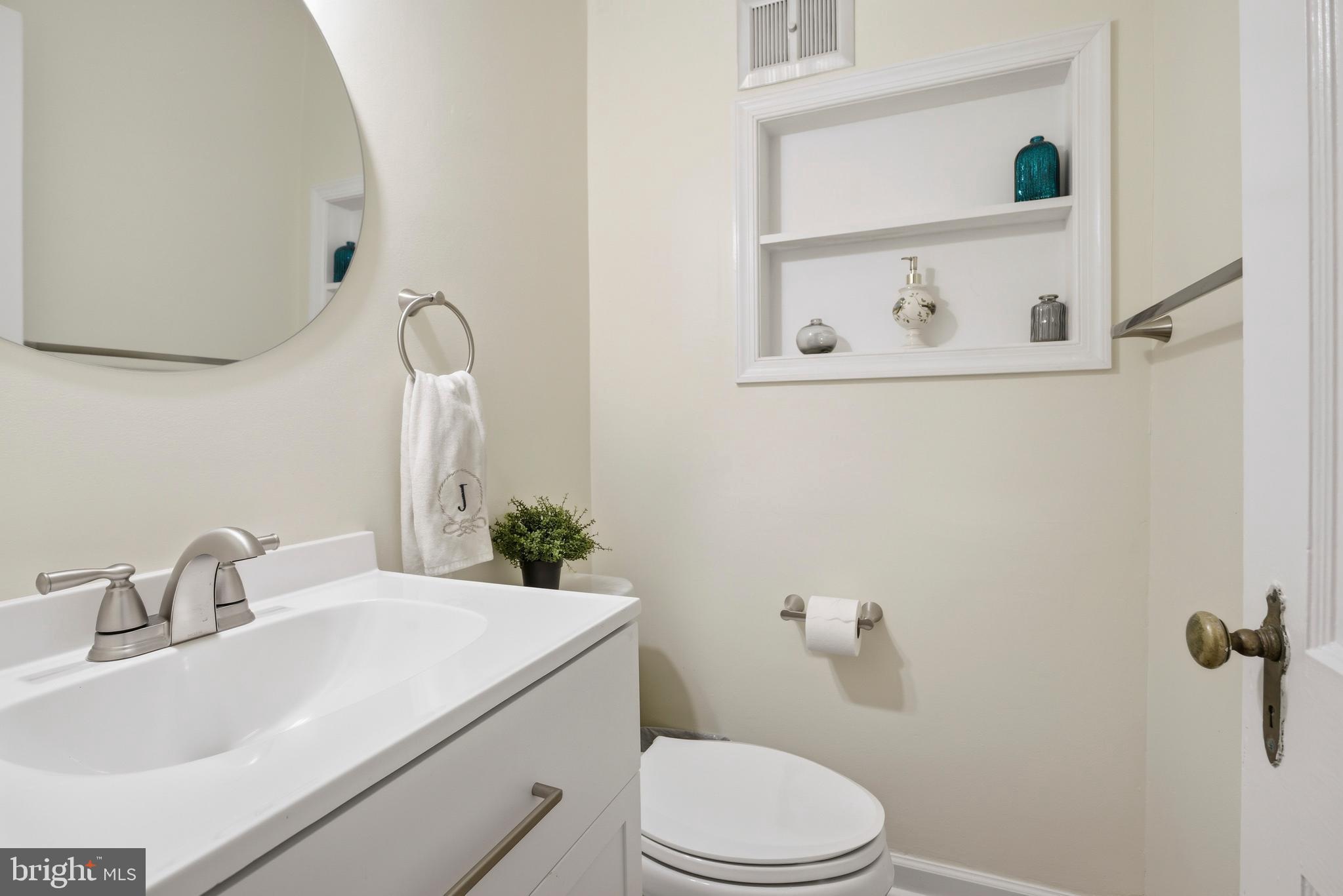 301 Riverview Road Swarthmore, PA 19081 - Photo 16 of 46 a bathroom with a sink a toilet and a mirror