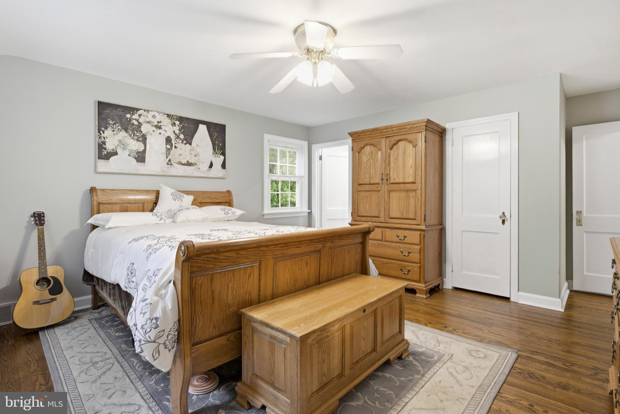 301 Riverview Road Swarthmore, PA 19081 - Photo 19 of 46 a bedroom with a bed and a chandelier