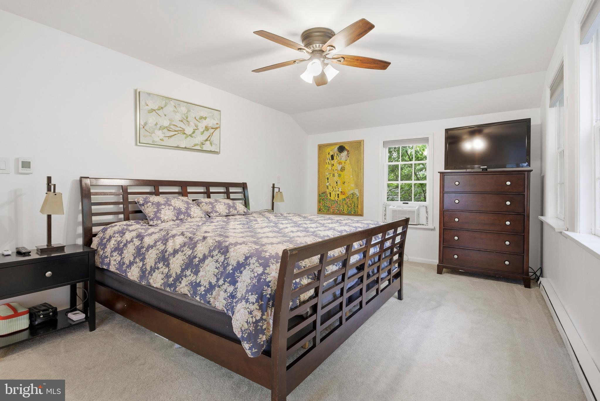 301 Riverview Road Swarthmore, PA 19081 - Photo 23 of 46 a bedroom with a bed and a chandelier