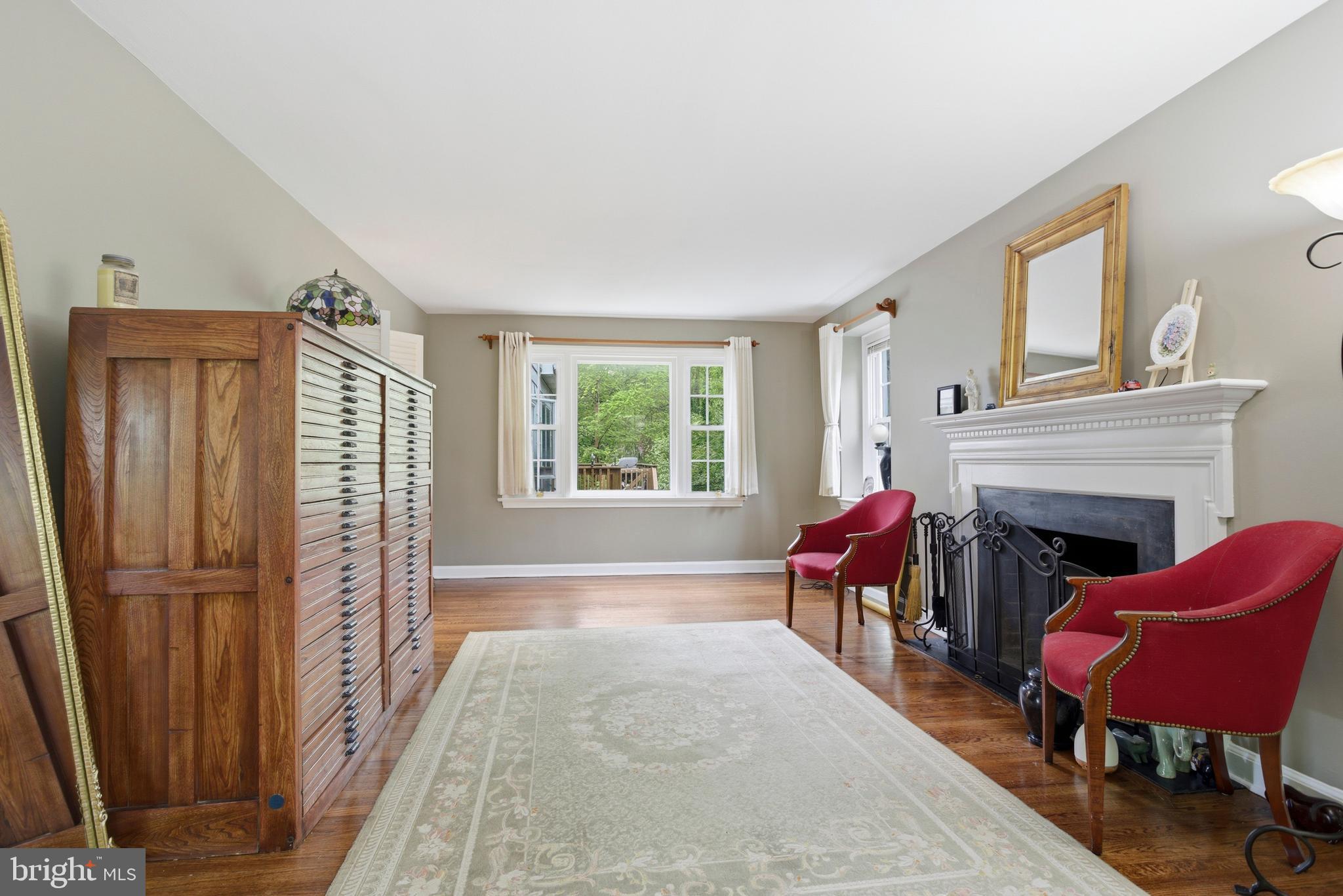 301 Riverview Road Swarthmore, PA 19081 - Photo 5 of 46 a living room with furniture and a fireplace