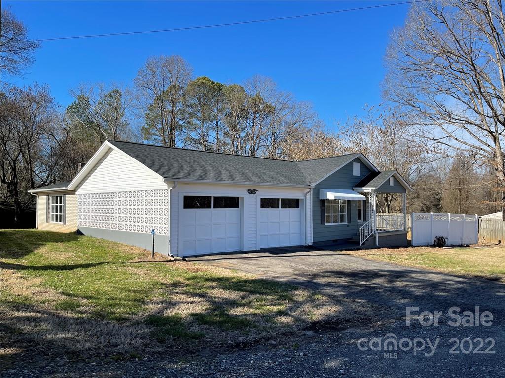 821 Sulphur Springs Road Hiddenite, NC 28636 - Photo 3 of 30 a view of a house with a yard