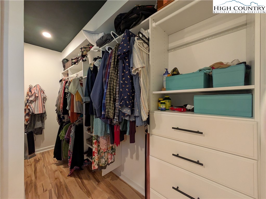 399 Ravens Ridge Circle Boone, NC 28607 - Photo 15 of 42 a view of walk in closet with clothes and shoes